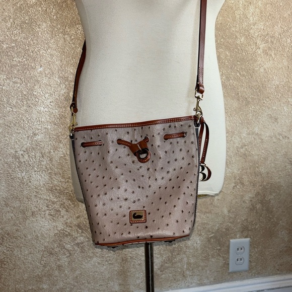 Dooney & Bourke bucket purse. Color~tan & camel ostrich leather. Pics for size. - Picture 1 of 16